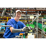 Marc Rumer works on the six-cylinder engine final assembly line at Toyota West Virginia. Rumer has been a team member at the Buffalo plant since 2000. (Photo: Business Wire)