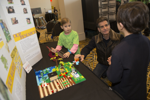 Inventor and FIRST founder Dean Kamen talks with Detroit-based FIRST student about their FIRST LEGO League Jr. project. (Photo: Business Wire)