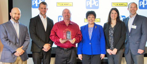 Karen Barkac (center right), PPG global director, transportation and logistics, and PPG transportation managers Mandi Penrod and Steve Minick (far right) present a 2015 Excellent Supplier Award to J.B. Hunt Transport representatives (from far left) Jerry Hoban, regional operations manager; Jamie Kleemook, transportation general manager; and Daniel Fike, Two Million Mile safe driver. (Photo: Business Wire)