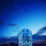 Carvana's Frisco, Texas Car Vending Machine stands eight stories tall, contains four delivery bays and holds up to 30 cars. Upon completing the entire vehicle purchase process online, customers can opt to pick up their vehicle from the new Frisco Car Vending Machine, or choose to receive as-soon-as-next-day delivery service within 100 miles of the Dallas metropolitan area. (Photo: Business Wire)