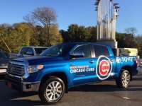TOYOTA TUNDRA CARRIES TEN-FOOT-TALL WORLD SERIES TROPHY DURING CUBS VICTORY PARADE