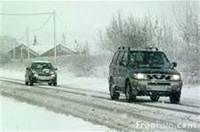 car in snow (select to view enlarged photo)