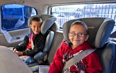 child in booster seat (select to view enlarged photo)